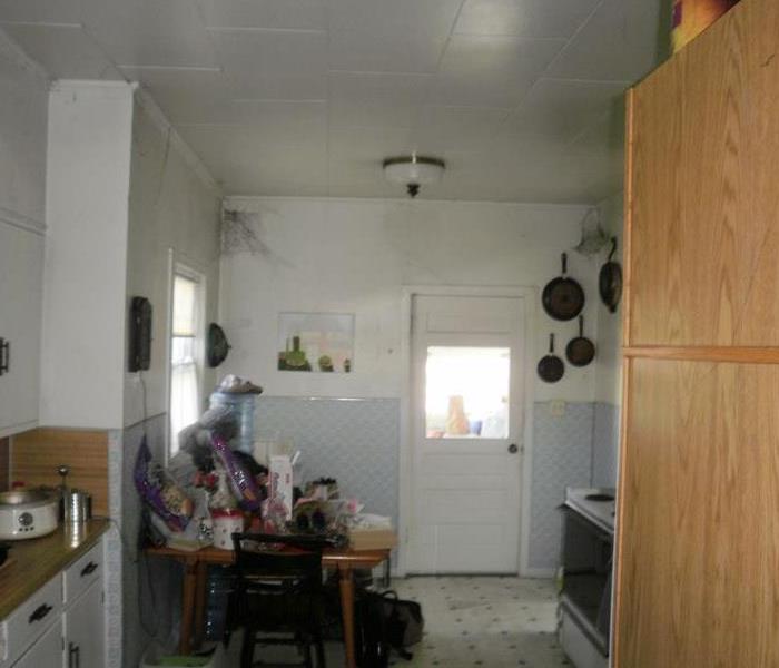 Image of a kitchen with soot webs in upper corners