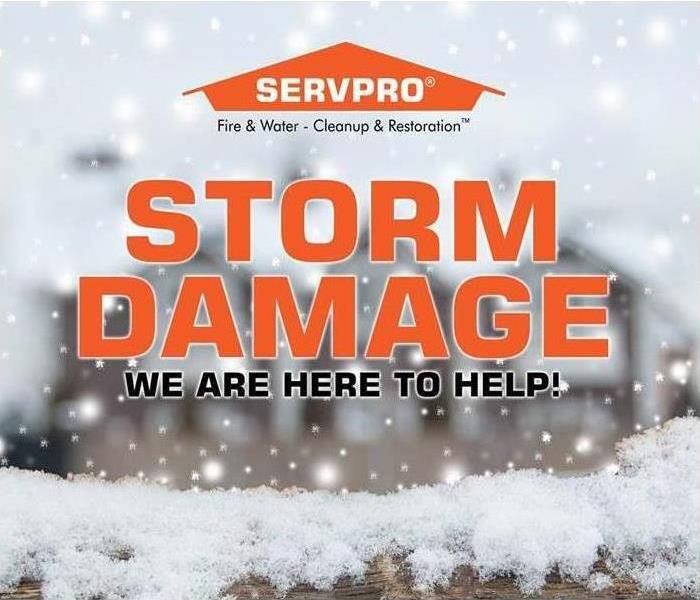 Blurry image of snow falling and SERVPRO logo and text storm damage we are here to help