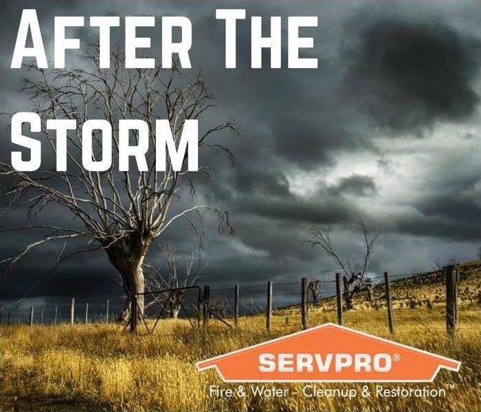 A view of a field and the skies are gray from a storm with SERVPRO logo and text saying After the storm