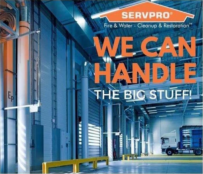 A warehouse with SERVPRO logo and text saying We can handle the big stuff