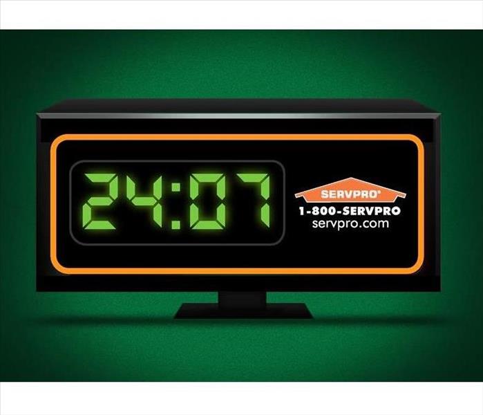 Green background with a clock with time at 24:07 and SERVPRO logo, phone and webpage